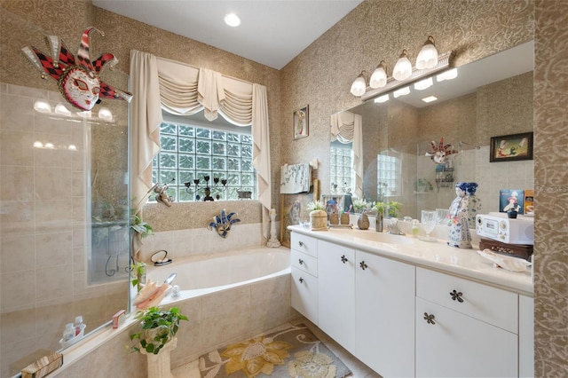 bathroom featuring vanity and plus walk in shower