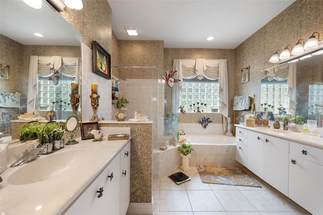 bathroom with shower with separate bathtub, vanity, tile patterned floors, and plenty of natural light