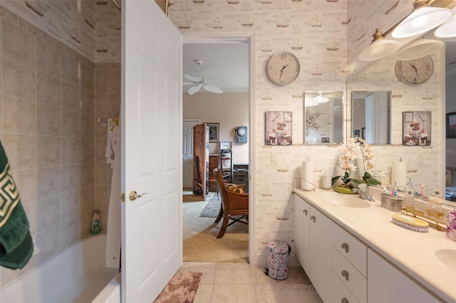 bathroom featuring vanity, tile patterned floors, and tiled shower / bath