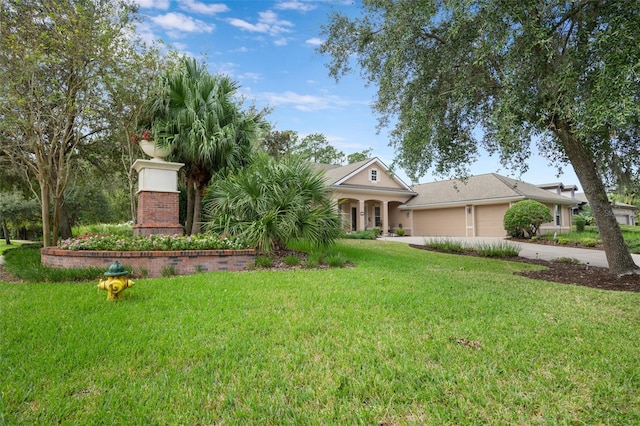 view of front facade featuring a garage and a front lawn