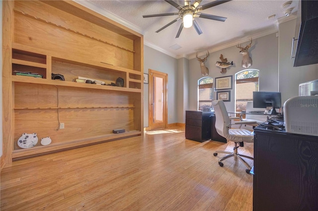 home office with a textured ceiling, hardwood / wood-style flooring, ceiling fan, and ornamental molding