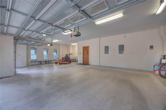 garage with electric panel and a garage door opener