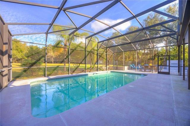 view of pool with a lanai and a patio area