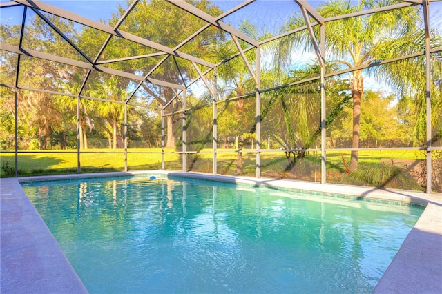 view of swimming pool featuring a lawn and glass enclosure