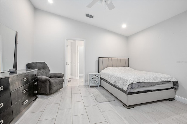 bedroom with ceiling fan and high vaulted ceiling