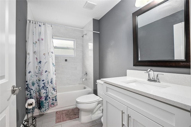 full bathroom featuring vanity, shower / bath combo, and toilet