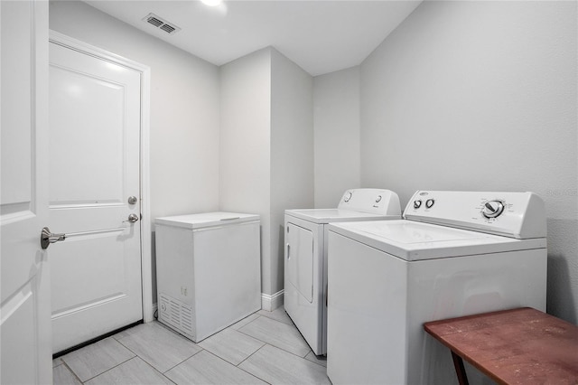 washroom with separate washer and dryer