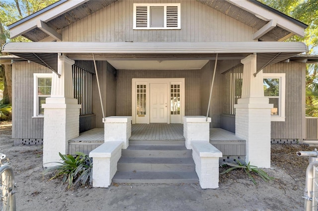 907 E N Bay St, Tampa, FL 33603 - doorway to property featuring covered porch