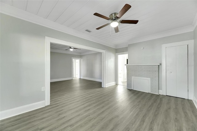 unfurnished living room featuring hardwood / wood-style floors, wooden ceiling, crown molding, a brick fireplace, and ceiling fan