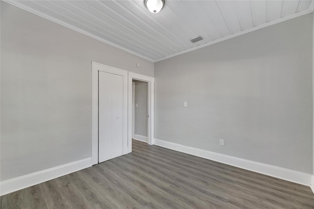 907 E N Bay St, Tampa, FL 33603 - unfurnished room with crown molding, baseboards, and wood finished floors