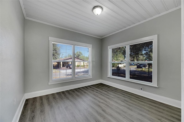 empty room featuring crown molding, wooden ceiling, and dark wood-type flooring