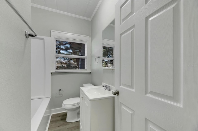 full bathroom featuring shower / bathtub combination, vanity, crown molding, hardwood / wood-style flooring, and toilet