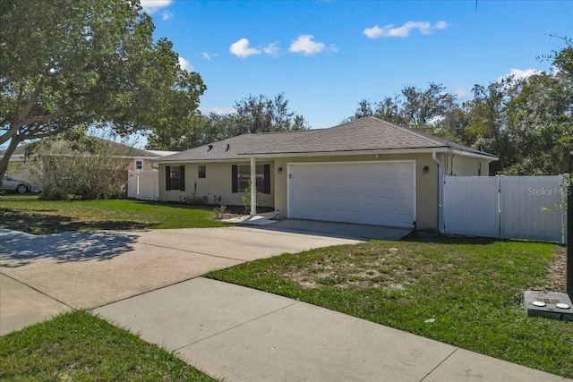 single story home with a front yard and a garage