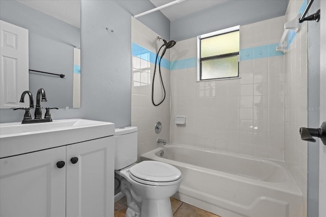 full bathroom with toilet, tile patterned floors, vanity, and tiled shower / bath combo