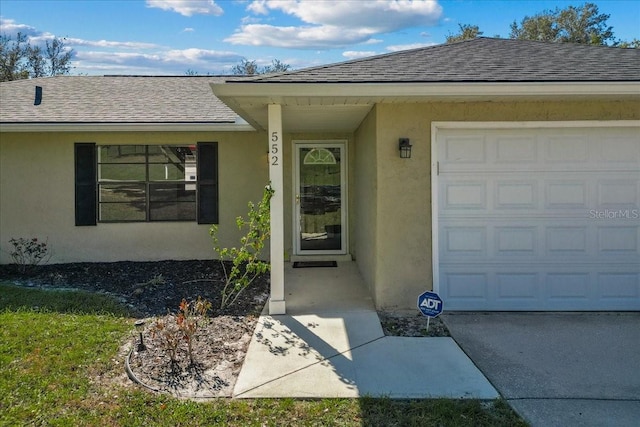 entrance to property featuring a garage