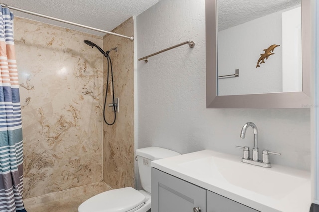 bathroom featuring vanity, a textured ceiling, and walk in shower