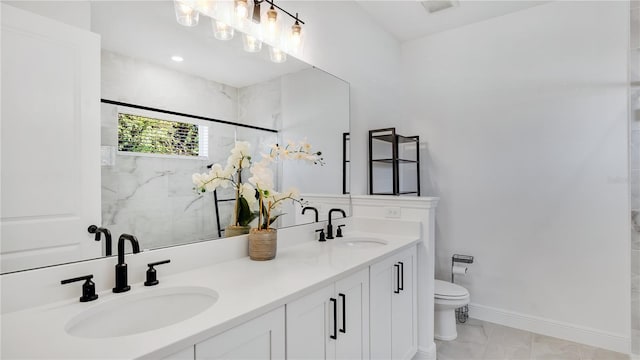 bathroom with vanity, a shower with shower door, and toilet