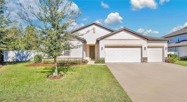 single story home featuring a garage and a front lawn