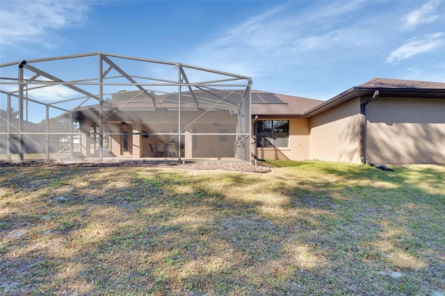 view of yard with glass enclosure