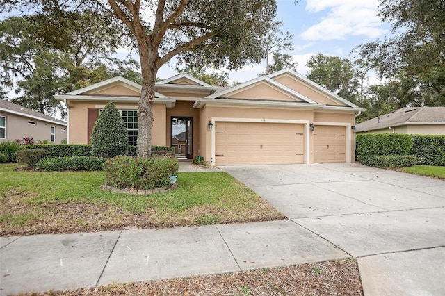 view of front facade featuring a front yard and a garage