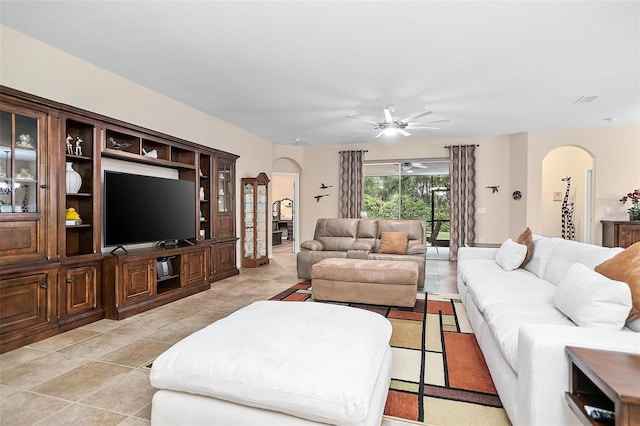 living room with ceiling fan and light tile patterned floors