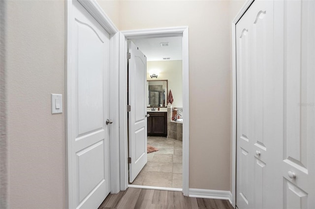 hall featuring light hardwood / wood-style flooring