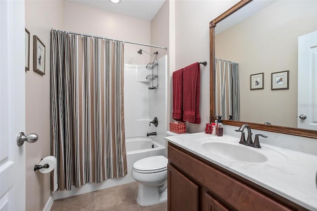 full bathroom featuring tile patterned floors, vanity, toilet, and shower / bath combo