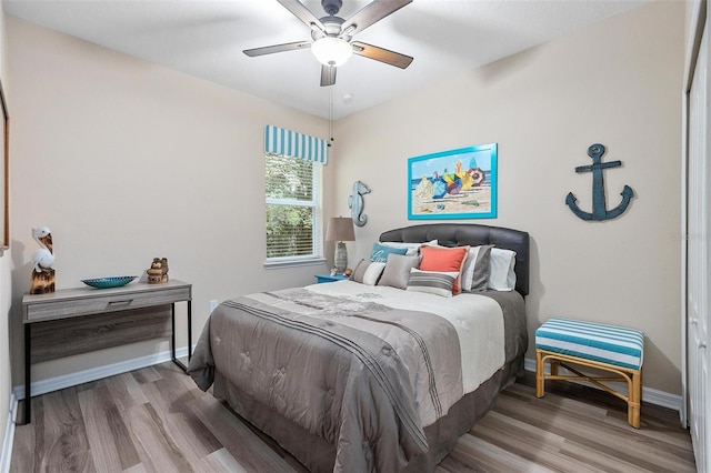 bedroom featuring ceiling fan and hardwood / wood-style floors