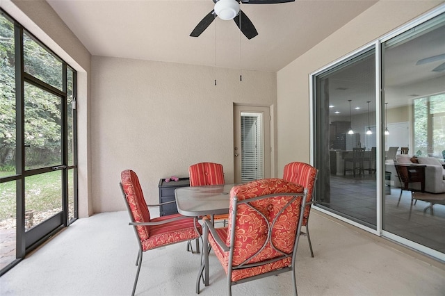 sunroom featuring plenty of natural light and ceiling fan