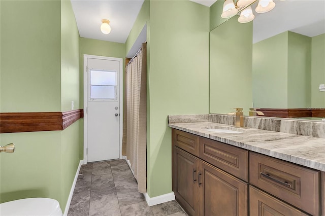 bathroom with vanity and toilet