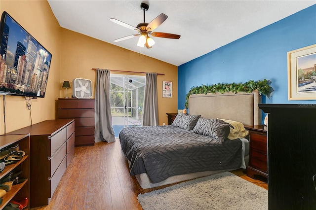 bedroom with access to outside, ceiling fan, hardwood / wood-style floors, and lofted ceiling