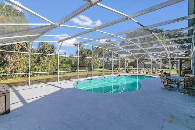 view of pool with a patio and a lanai