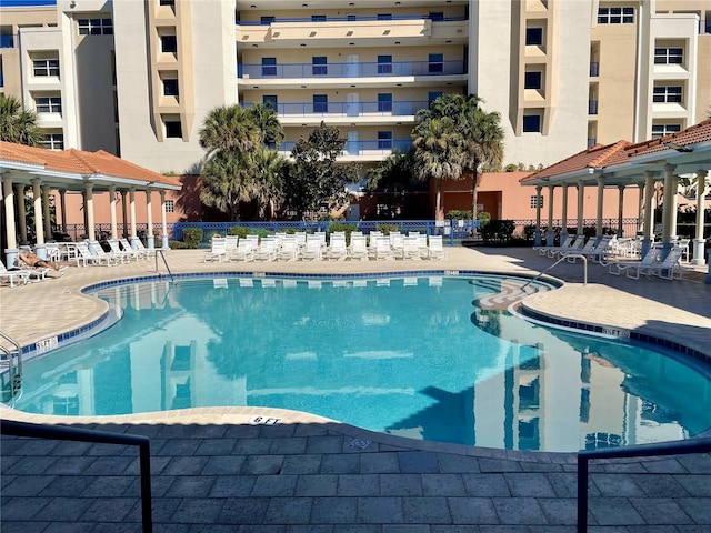 view of swimming pool with a patio