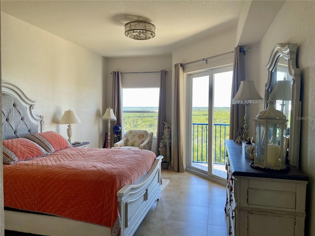 bedroom featuring access to outside, multiple windows, and light tile patterned floors