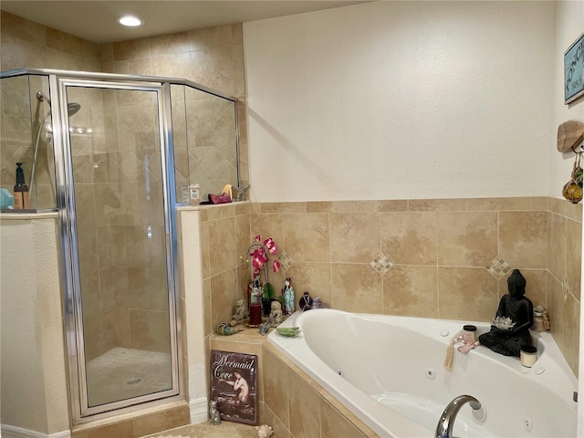 bathroom featuring separate shower and tub