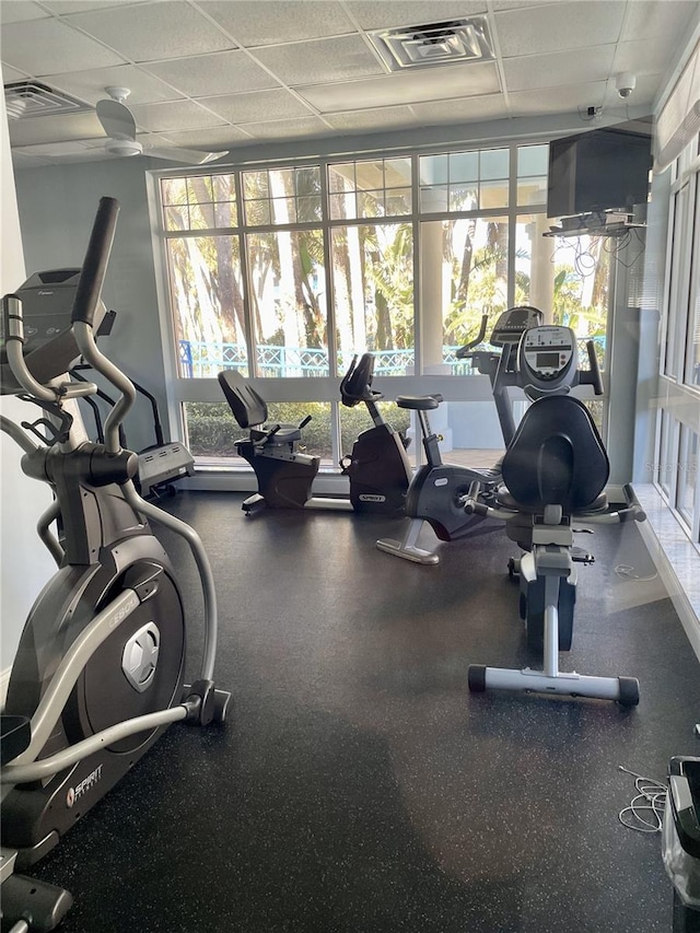 workout area featuring a paneled ceiling