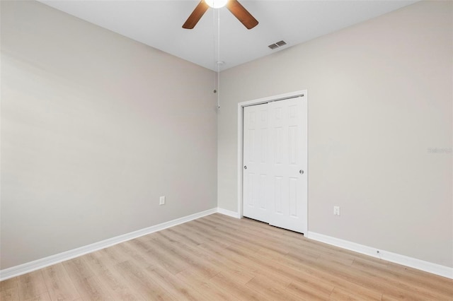 unfurnished room with light hardwood / wood-style floors and ceiling fan