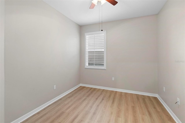 empty room featuring ceiling fan and light hardwood / wood-style flooring