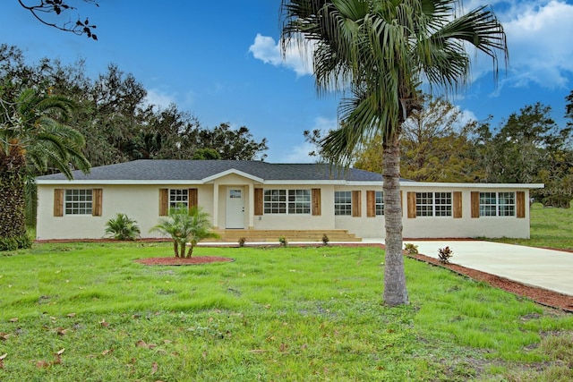 ranch-style home with a front lawn