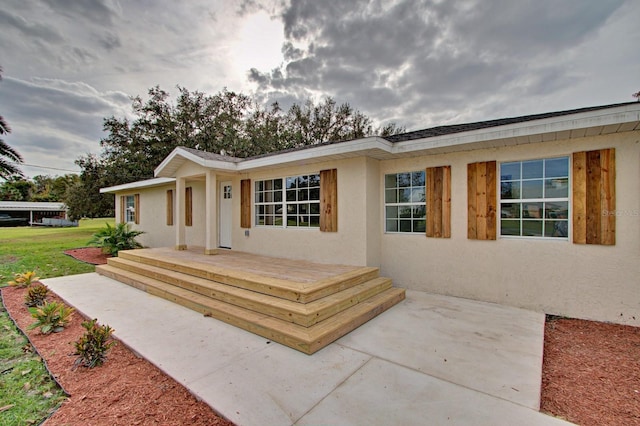 view of front of property with a wooden deck