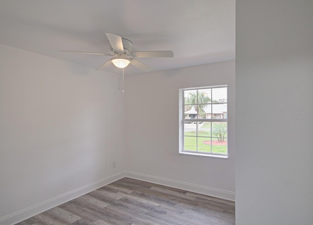 empty room with light hardwood / wood-style floors and ceiling fan