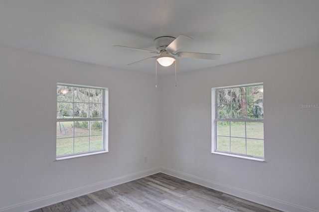 spare room with ceiling fan and light hardwood / wood-style floors