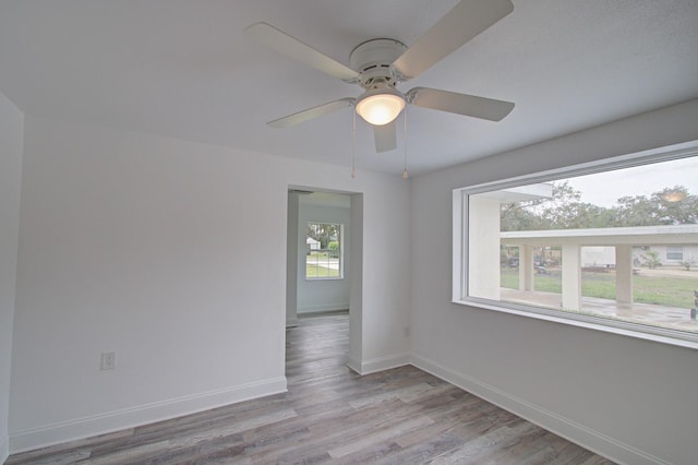 empty room featuring ceiling fan and light wood-type flooring