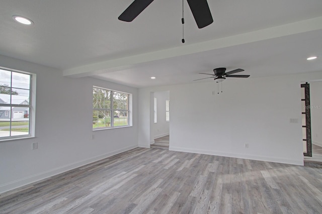 unfurnished room with light hardwood / wood-style flooring and ceiling fan