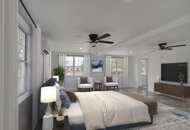 bedroom with light hardwood / wood-style floors, an AC wall unit, and ceiling fan