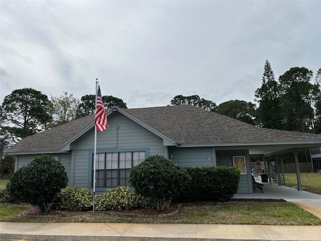 view of front facade with a carport