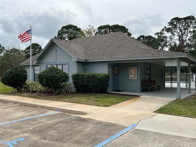 view of front of home with a carport