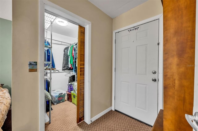 entryway featuring light colored carpet