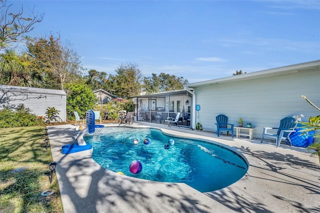 view of swimming pool with a patio