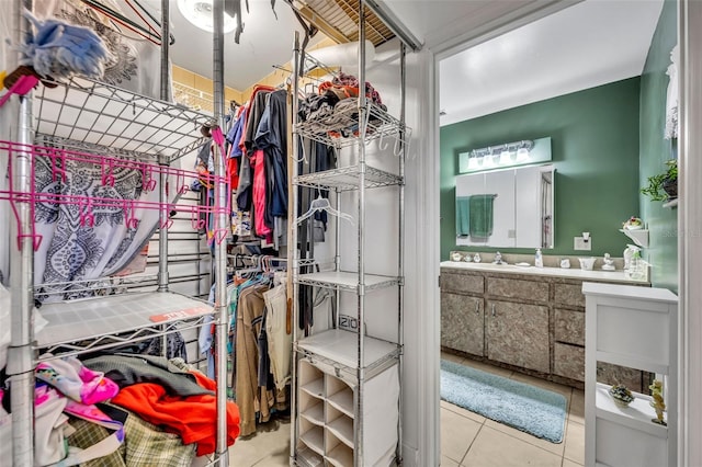 spacious closet with light tile patterned floors